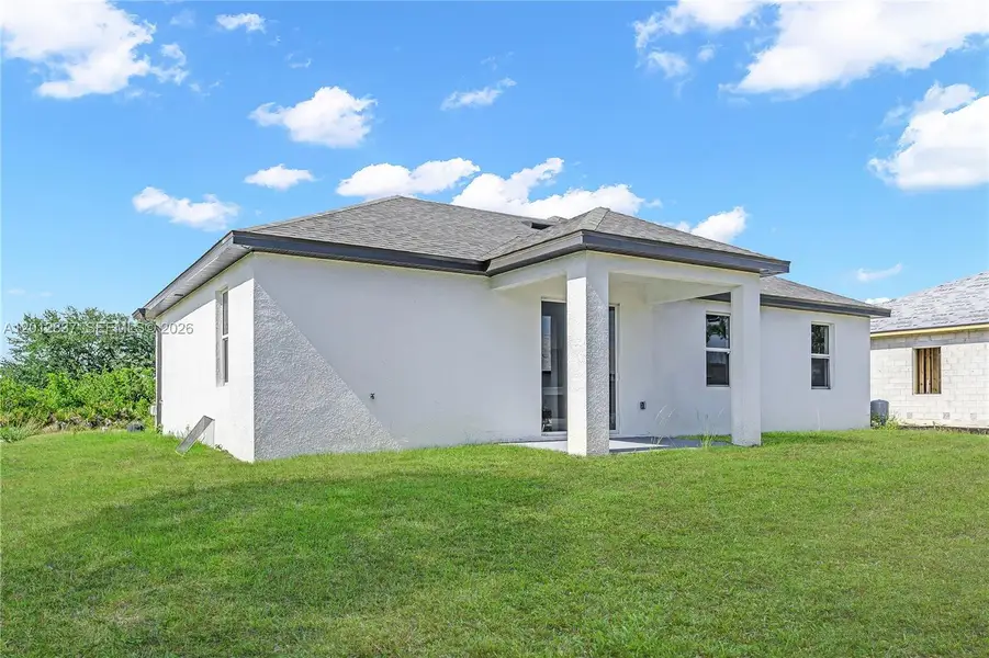 Exterior details and patio area of a home in , Lehigh Acres (Image 4).