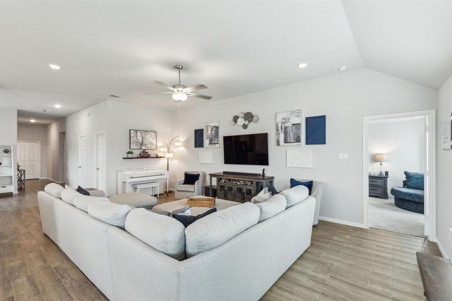 Living room with view to front door/hallway and to primary bedroom Living room with view to front door/hallway and to primary bedroom