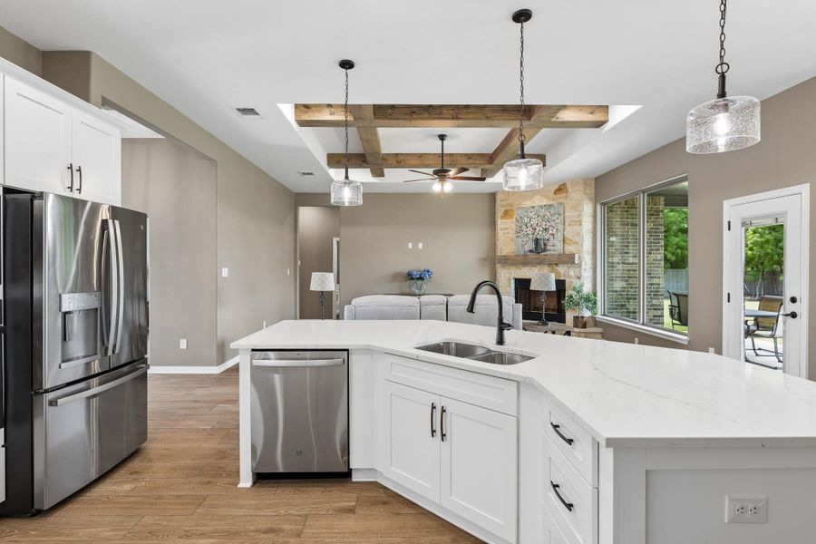 Thoughtfully positioned at the center of it all, the kitchen remains connected to every conversation, every gathering, and every day in between.
