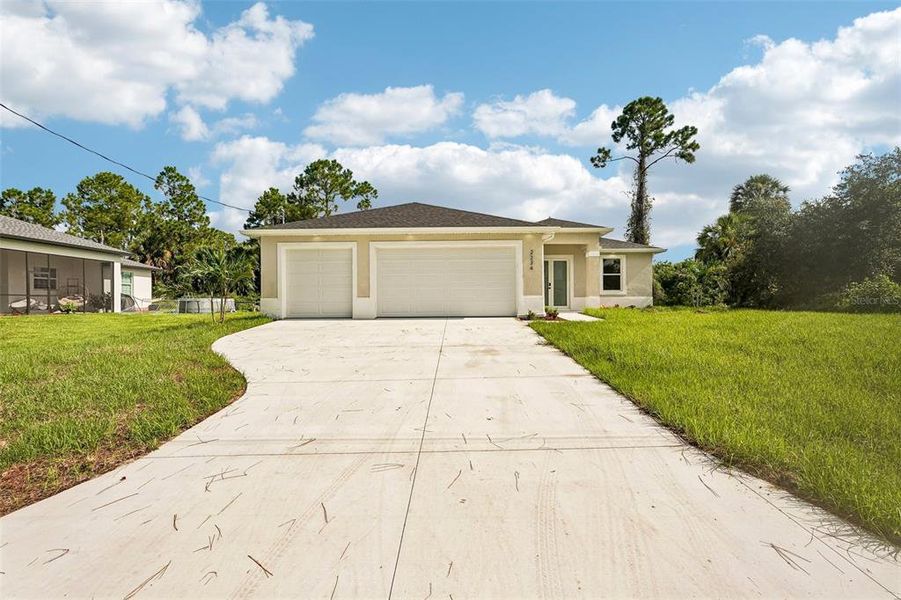 Front exterior of a new home in , North Port, FL, highlighting curb appeal (Image 20).