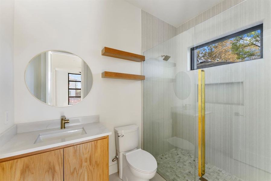 Full bath featuring vanity and walk in shower Full bath featuring vanity and walk in shower