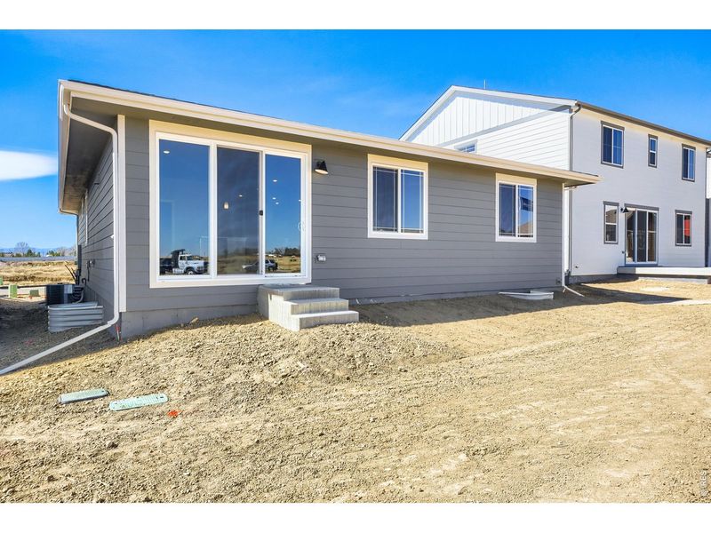 Exterior details and patio area of a home in Farmstead, Berthoud (Image 3).