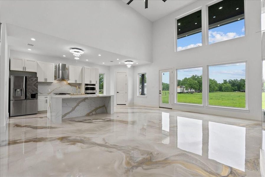Open-concept living and kitchen area filled with natural light.