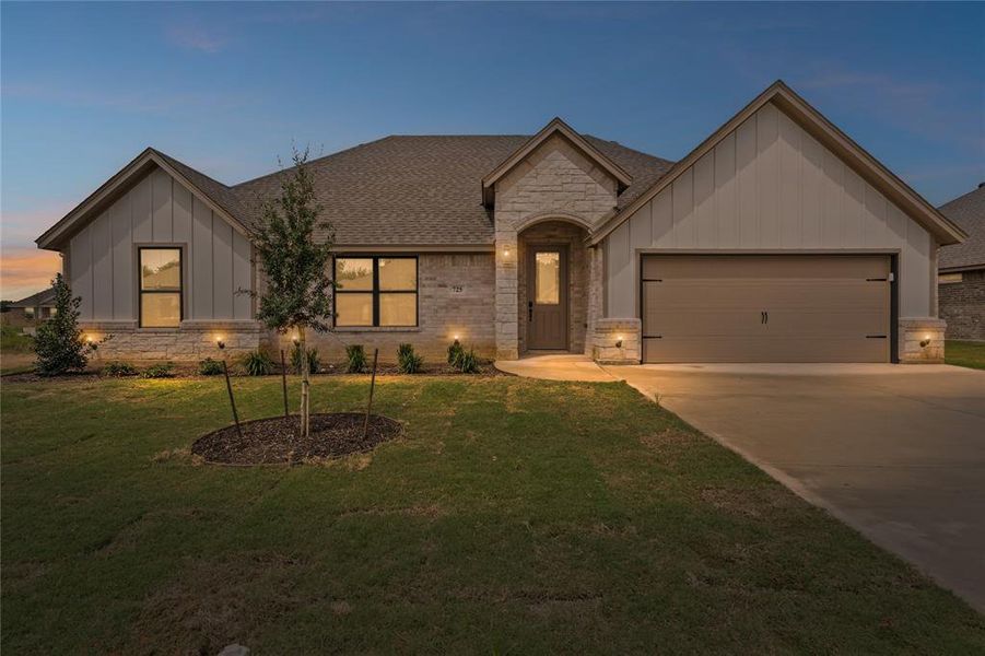 Front exterior of a new home in , Springtown, TX, highlighting curb appeal (Image 27).