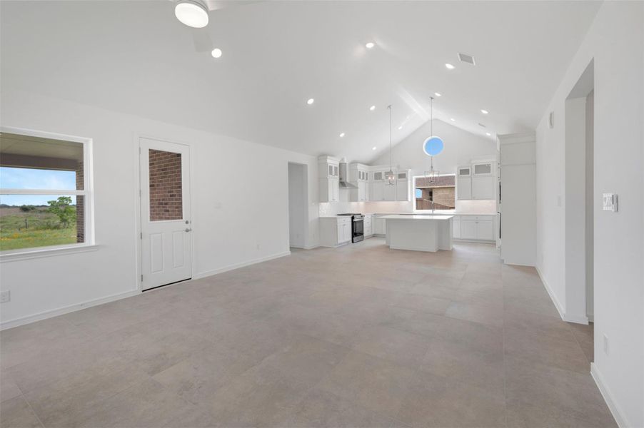High vaulted ceiling throughout the living area High vaulted ceiling throughout the living area