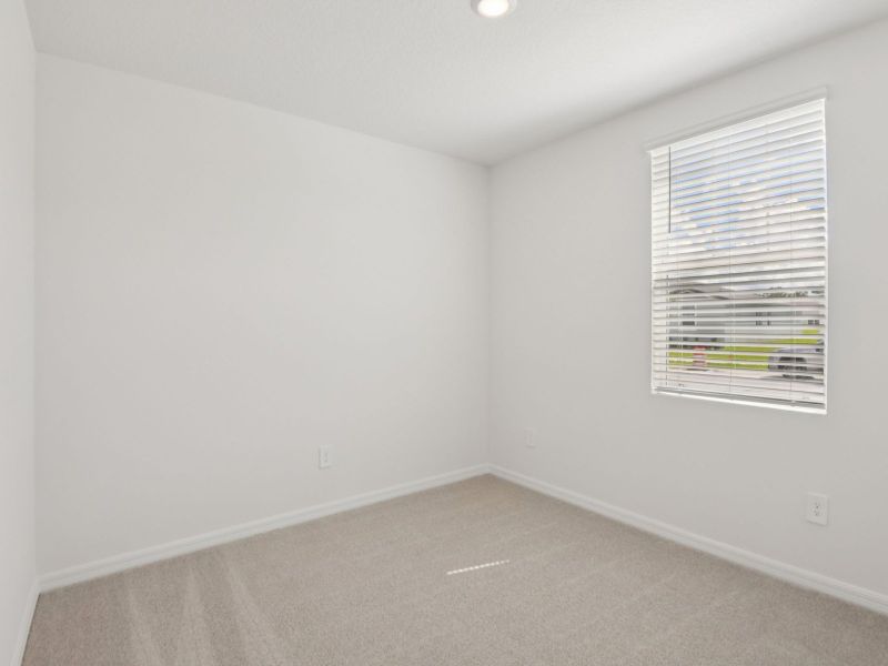 Spacious, unfurnished interior of a new home in The Grove at Stuart Crossing - Classic Series, Bartow (Image 12).