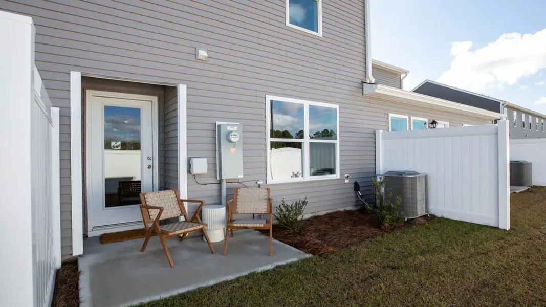 Exterior details and patio area of a home in Waterside Townhomes, Surf City (Image 3).