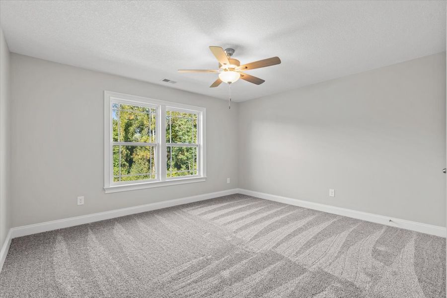 Representative unfurnished interior of a home built from the Enory by Enchanted Homes in Guadalupe Heights, Seguin (Image 39).