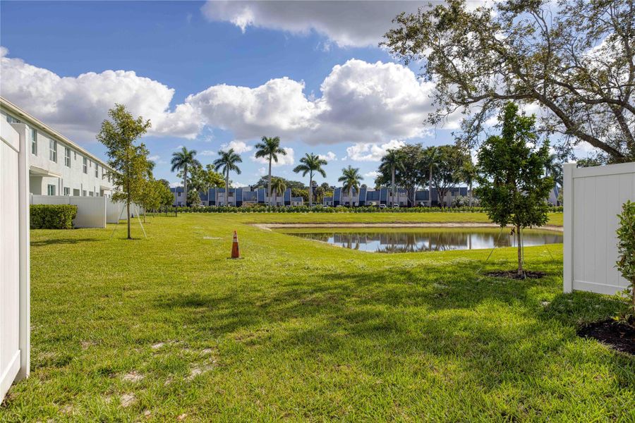 The view from the patio offers open greenspace and a view of the lake.