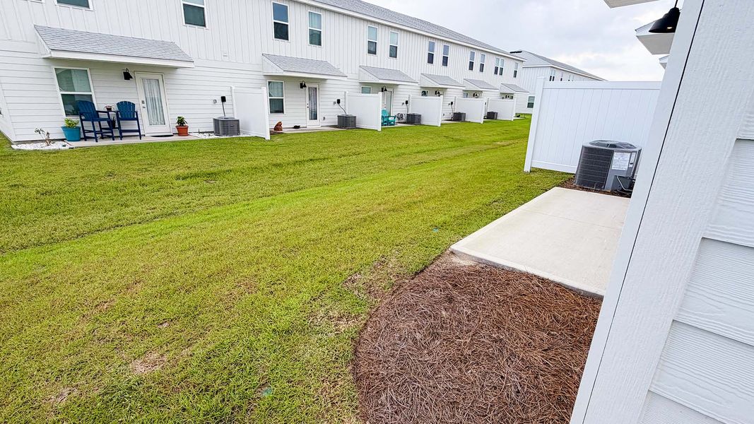 Exterior details and patio area of a home in Salt Creek Townhomes at Mexico Beach, Mexico Beach (Image 19). Exterior details and patio area of a home in Salt Creek Townhomes at Mexico Beach, Mexico Beach (Image 19).