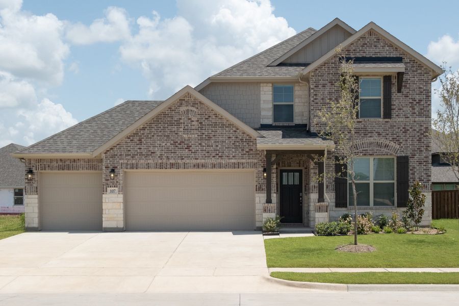 Front exterior of a new home in Brookville Estates, Forney, TX, highlighting curb appeal (Image 1). Front exterior of a new home in Brookville Estates, Forney, TX, highlighting curb appeal (Image 1).
