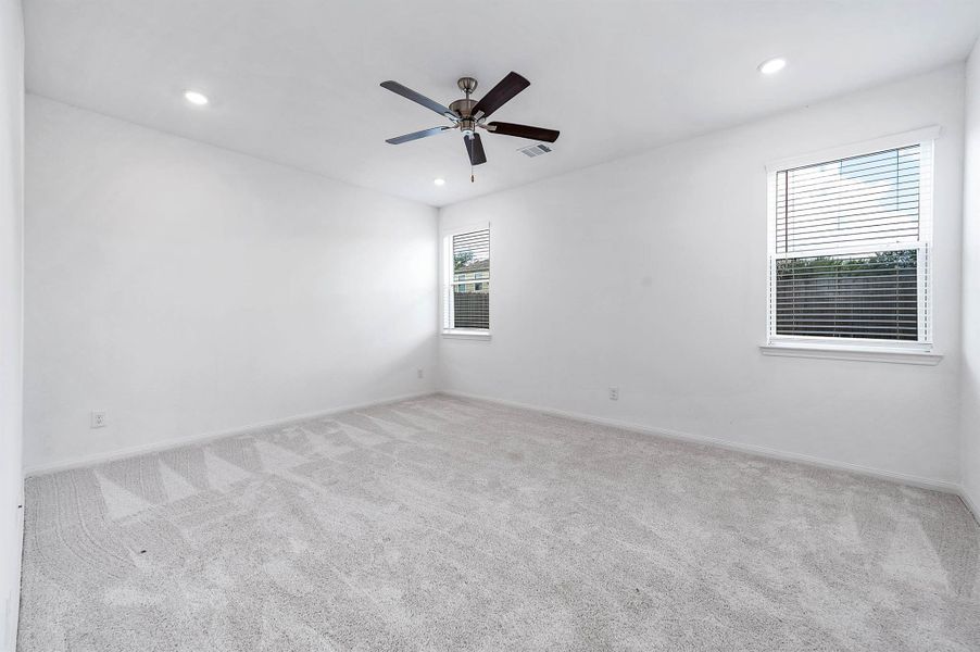 Spacious primary bedroom located on the 1st floor features an ensuite bath and his and her closets! Spacious primary bedroom located on the 1st floor features an ensuite bath and his and her closets!