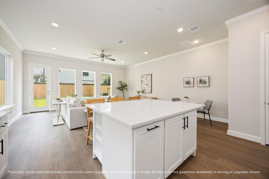 This huge island offers adjustable shelves, perfect for storing cookbooks or frequently accessed items, while providing a stunning view of the entire open-concept first-floor living space. This huge island offers adjustable shelves, perfect for storing cookbooks or frequently accessed items, while providing a stunning view of the entire open-concept first-floor living space.