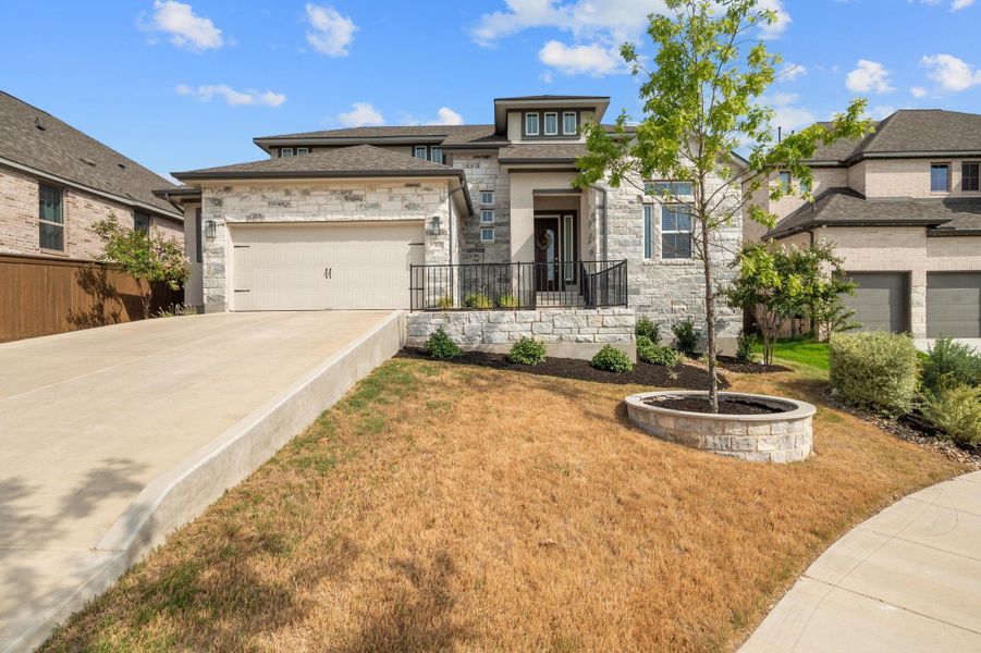Front exterior of a new home in , Leander, TX, highlighting curb appeal (Image 19). Front exterior of a new home in , Leander, TX, highlighting curb appeal (Image 19).
