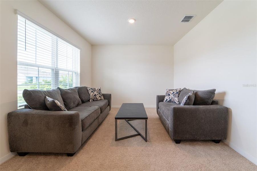 Furnished interior view inside a new home in , Harmony (Image 18).