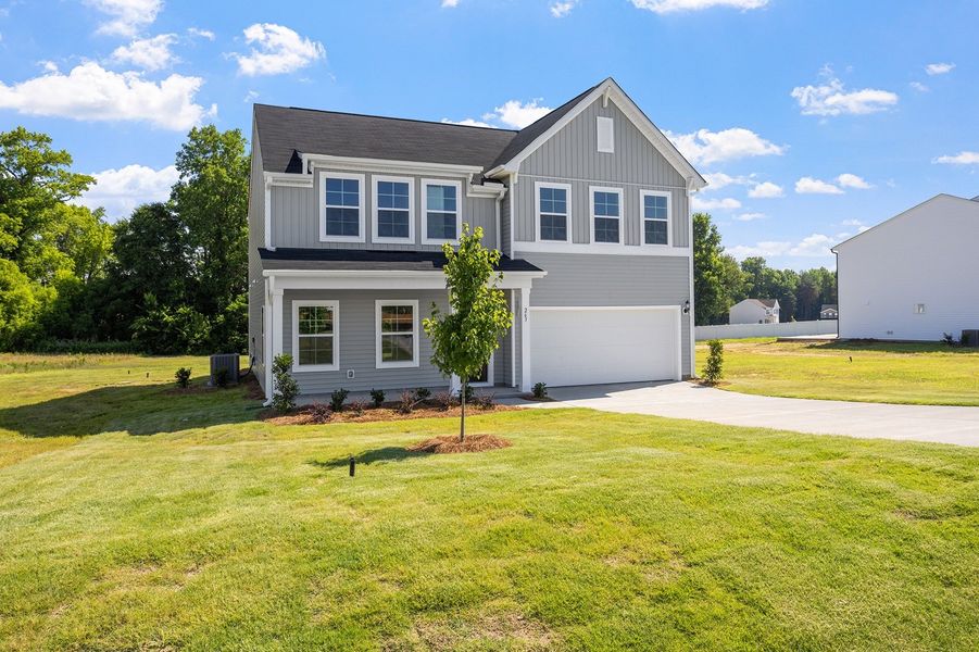 Front exterior of a new home in Cambridge Reserve, Angier, NC, highlighting curb appeal (Image 21). Front exterior of a new home in Cambridge Reserve, Angier, NC, highlighting curb appeal (Image 21).