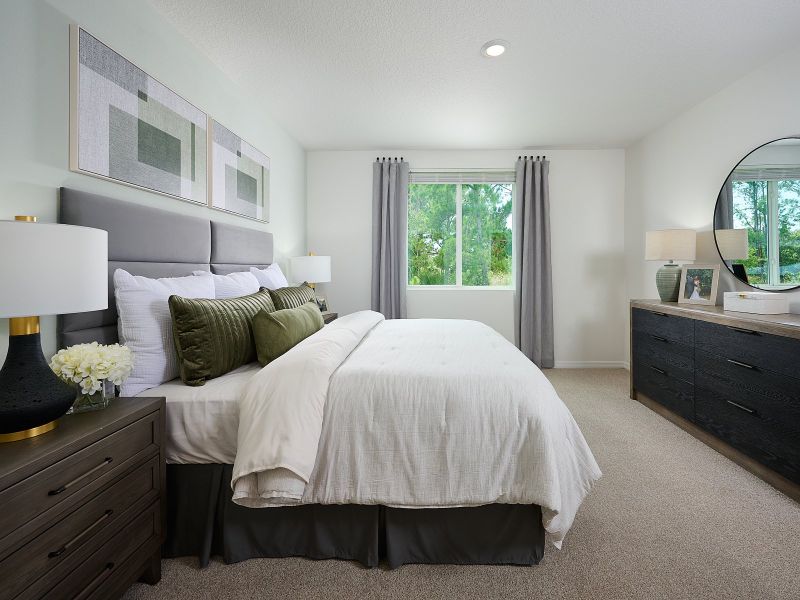 The Acadia Floorplan Primary Bedroom Modeled at Leyland Preserve.