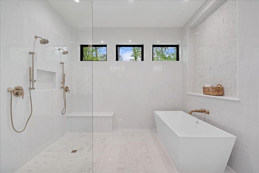 Schluter waterproofing behind the showers delivers the kind of hidden construction quality that protects the beauty of the home for years to come.