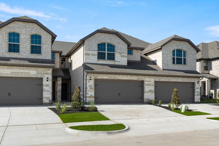 Front exterior of a new home in Main Street Village, Mansfield, TX, highlighting curb appeal (Image 2).