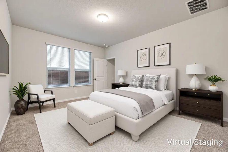 Carpeted bedroom featuring neutral wall paint, a ceiling-mounted light fixture, and two windows with blinds