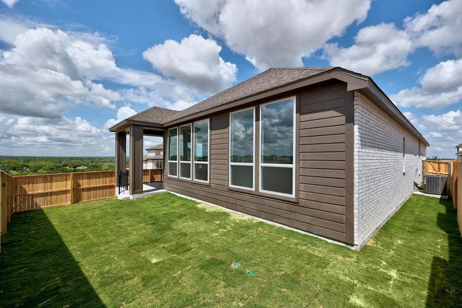 Exterior details and patio area of a home in Lariat, Liberty Hill (Image 2).