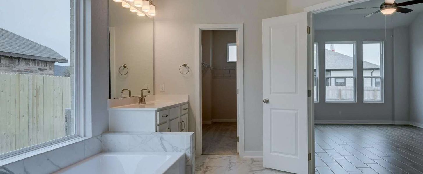Representative furnished interior of a home built from the Guadalupe by Ashton Woods in Saddlebrook Ranch, Schertz (Image 7).