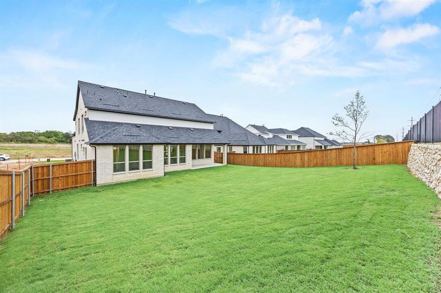 Exterior details and patio area of a home in Chatham Reserve, Providence Village (Image 2).