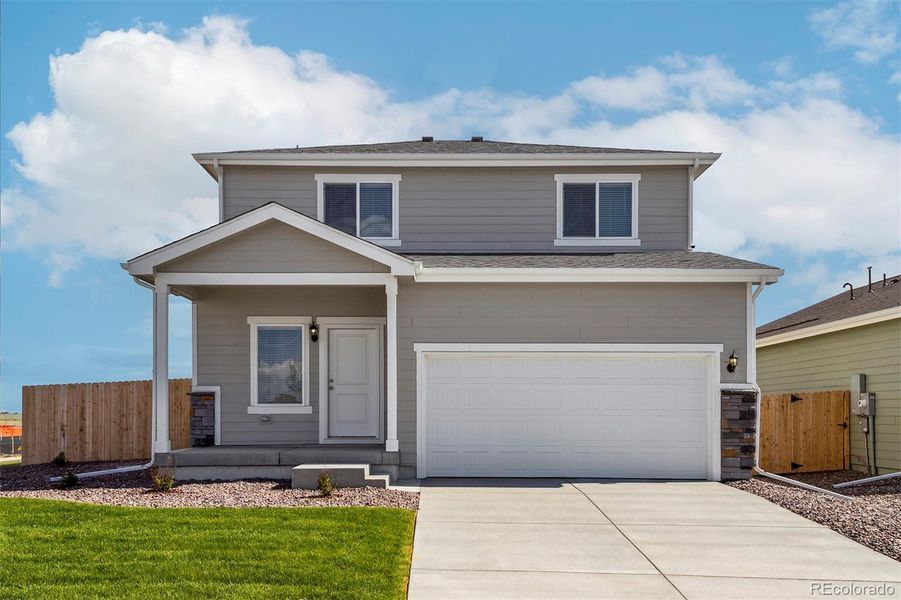 Front exterior of a new home in Bennett Ranch, Bennett, CO, highlighting curb appeal (Image 2).