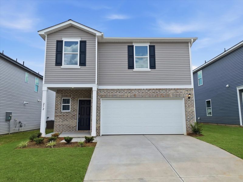 Front exterior of a new home in Pleasant Brook, Greenville, SC, highlighting curb appeal (Image 1). Front exterior of a new home in Pleasant Brook, Greenville, SC, highlighting curb appeal (Image 1).