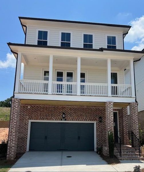 Front exterior of a new home in Palisades Single Family, Cumming, GA, highlighting curb appeal (Image 2).
