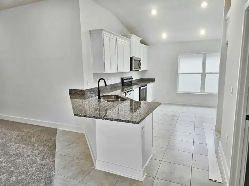 Furnished interior view inside a new home in Harmony Central, St. Cloud (Image 5).