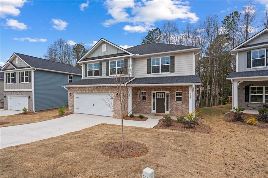 Front exterior of a new home in Canterbury Villas, Carrollton, GA, highlighting curb appeal (Image 17).