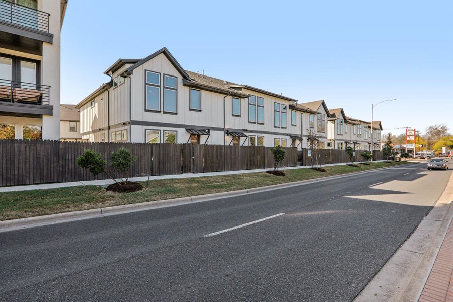 Front exterior of a new home in Koenig Townhomes, Austin, TX, highlighting curb appeal (Image 21).