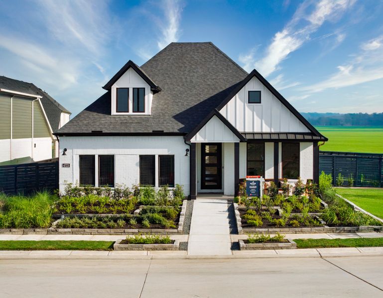 Front exterior of a new home in Austin Point, Richmond, TX, highlighting curb appeal (Image 2). Front exterior of a new home in Austin Point, Richmond, TX, highlighting curb appeal (Image 2).
