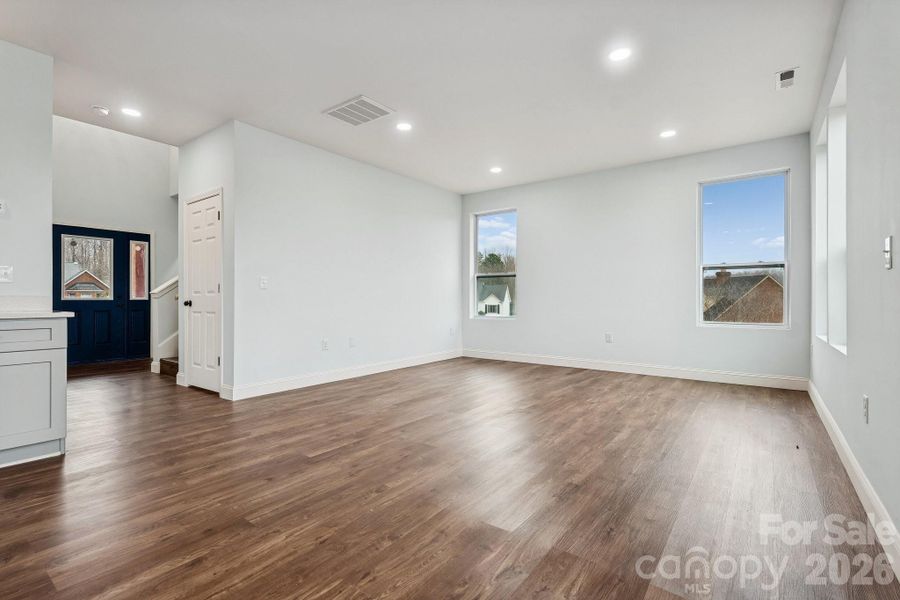 main living room offers open concept, recessed lighting, abundance of natural light and access to the rear deck