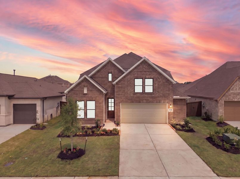 Front exterior of a new home in The Trails, New Caney, TX, highlighting curb appeal (Image 23).