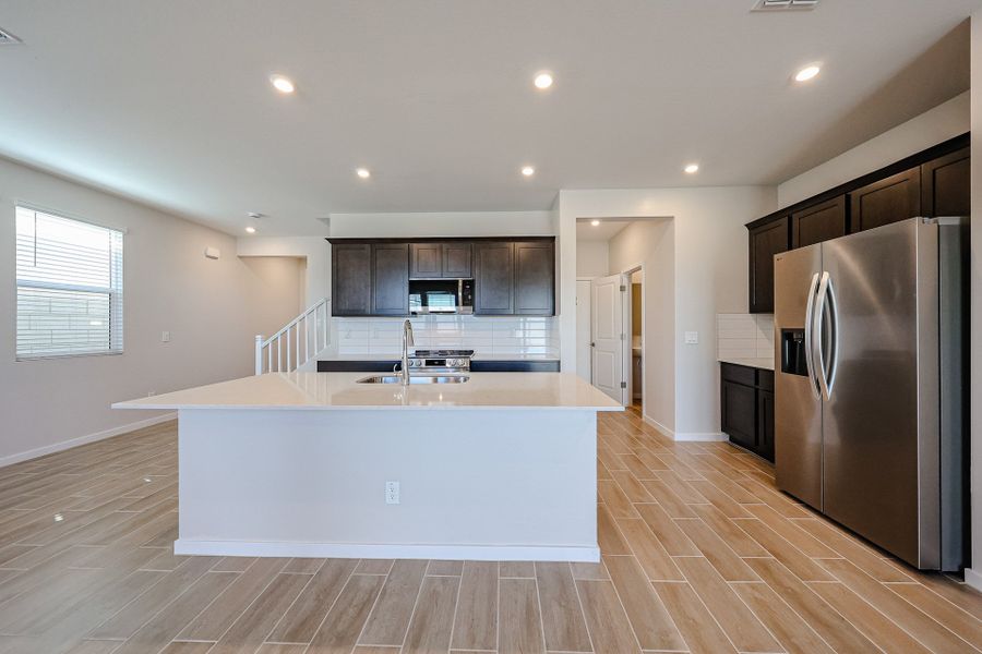 A kitchen with a large island. A kitchen with a large island.