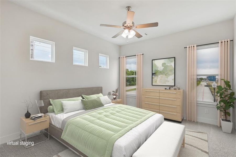 Bedroom featuring light carpet, multiple windows, and ceiling fan