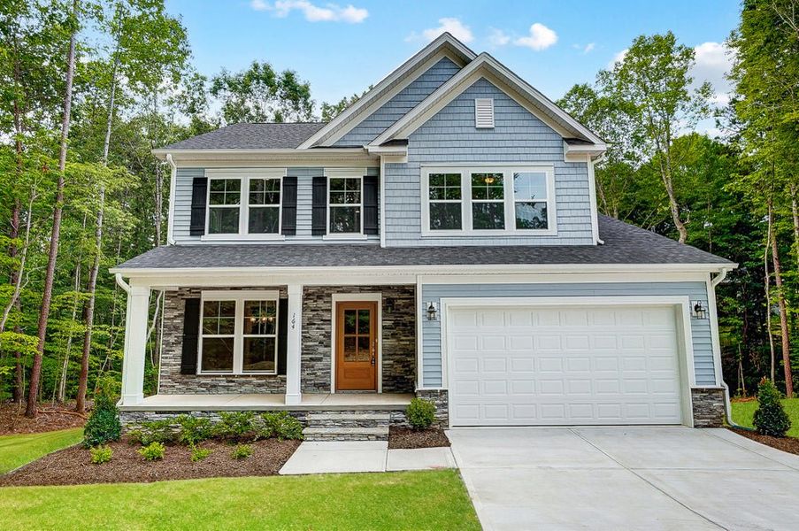 Representative exterior photo of a completed home built from the Badin by Caruso Homes in Blue Run, Raleigh, NC (Image 1). Representative exterior photo of a completed home built from the Badin by Caruso Homes in Blue Run, Raleigh, NC (Image 1).