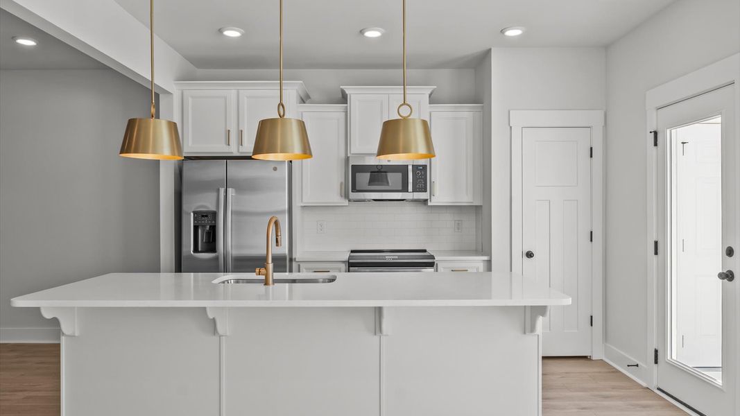 Accomplished layout with a stunning 9-foot island, pendant lighting, and superior craftsmanship