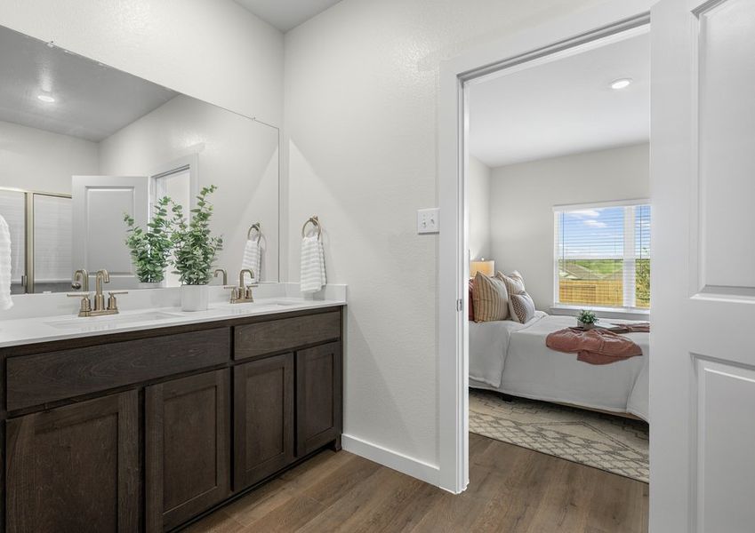 The master bathroom has a sprawling dual-sink vanity.