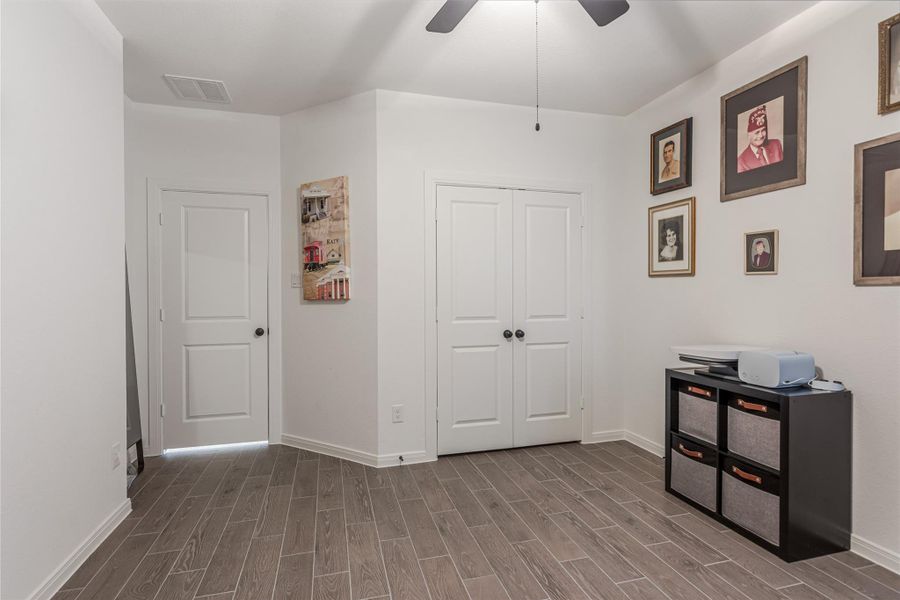 Another view of this 4th bedroom showing the double door closet and door leaving the room.