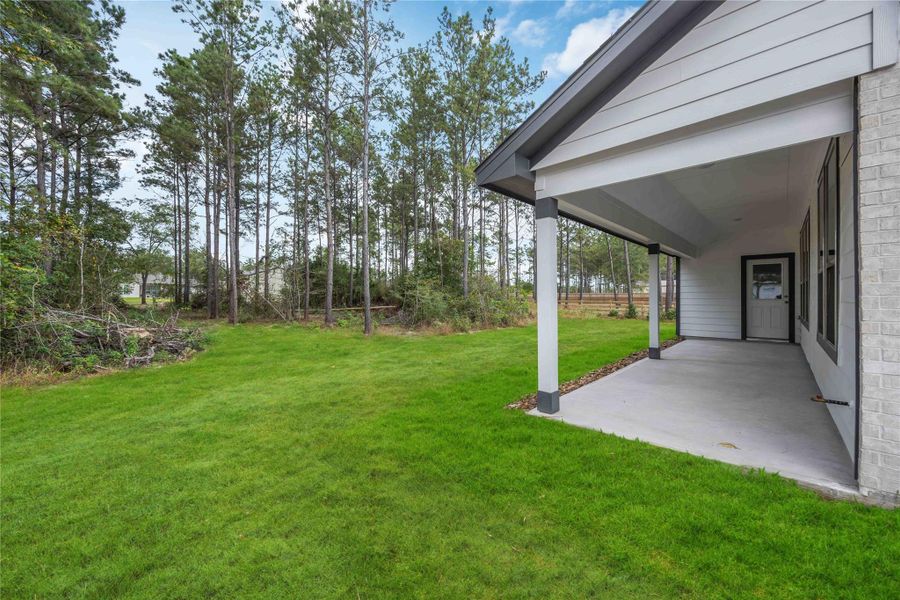 Exterior details and patio area of a home in Deer Pines, Conroe (Image 2). Exterior details and patio area of a home in Deer Pines, Conroe (Image 2).