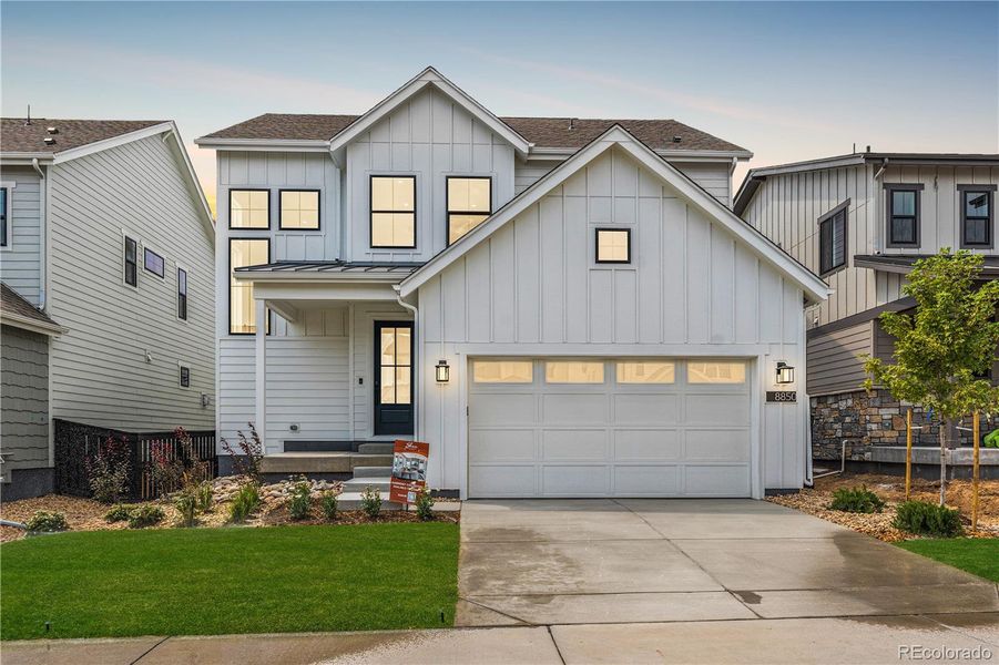 Front exterior of a new home in Harmony at Solstice, Littleton, CO, highlighting curb appeal (Image 1).