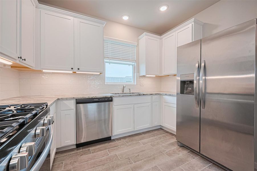 Furnished interior view inside a new home in Sunterra, Katy (Image 13).