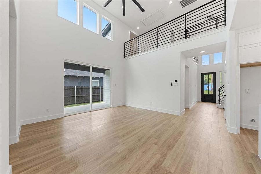 The property features high ceilings, light wood-style flooring, and an open layout The property features high ceilings, light wood-style flooring, and an open layout
