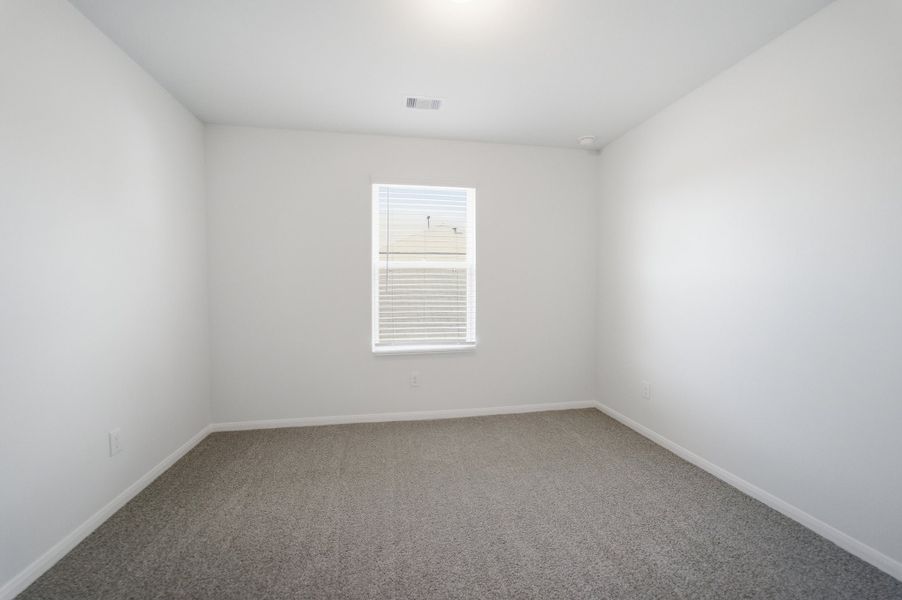 Spacious, unfurnished interior of a new home in The Pines at Seven Coves, Willis (Image 18).