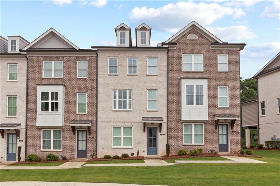 Front exterior of a new home in , Cumming, GA, highlighting curb appeal (Image 1). Front exterior of a new home in , Cumming, GA, highlighting curb appeal (Image 1).