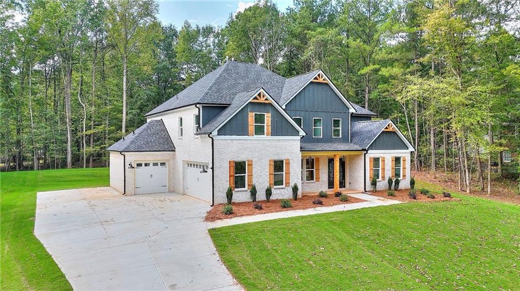 Front exterior of a new home in , Monroe, GA, highlighting curb appeal (Image 18). Front exterior of a new home in , Monroe, GA, highlighting curb appeal (Image 18).