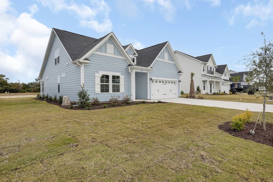 Front exterior of a new home in East Wynd, Hampstead, NC, highlighting curb appeal (Image 2).